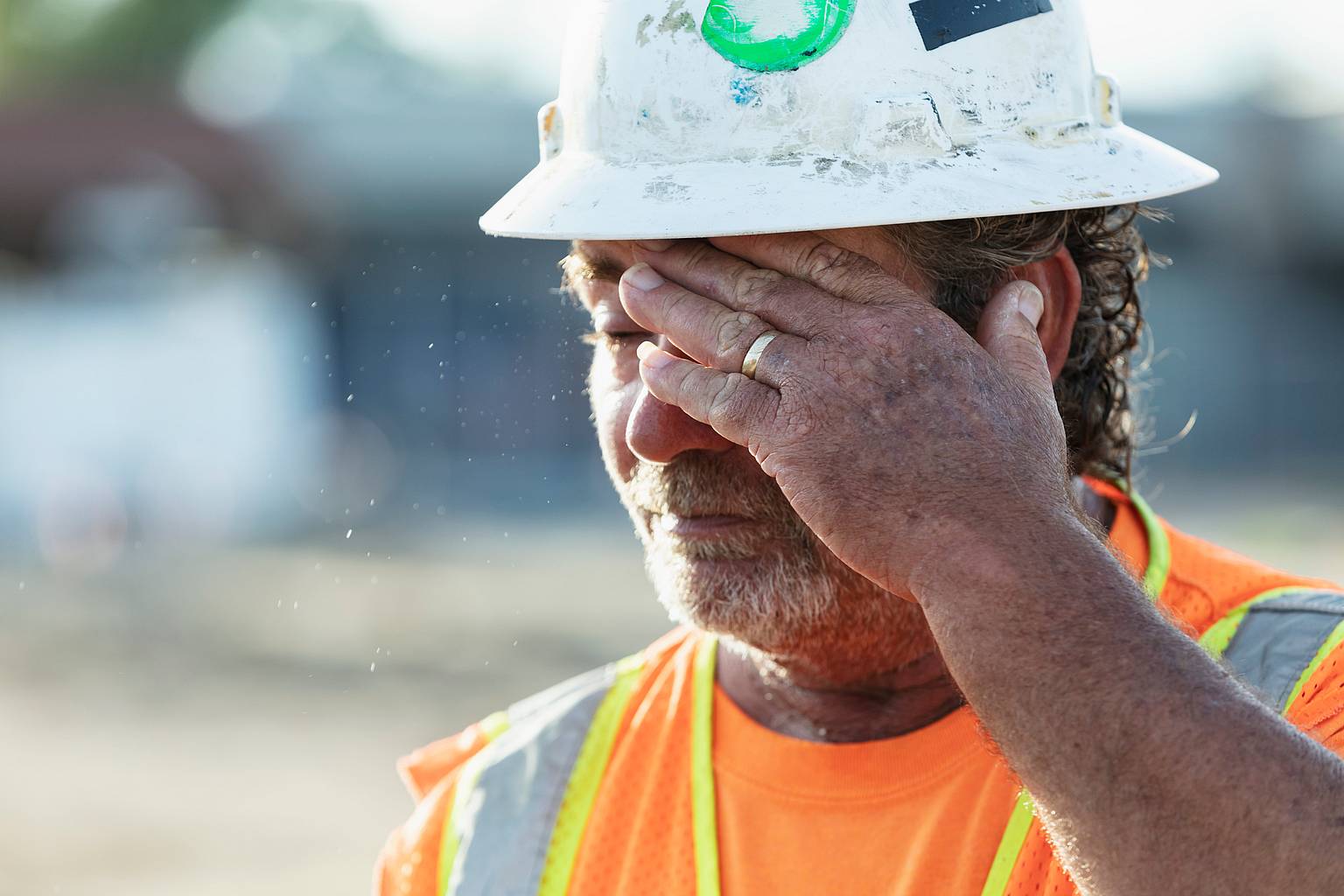 A construction worker showing the effects of working in hot conditions.