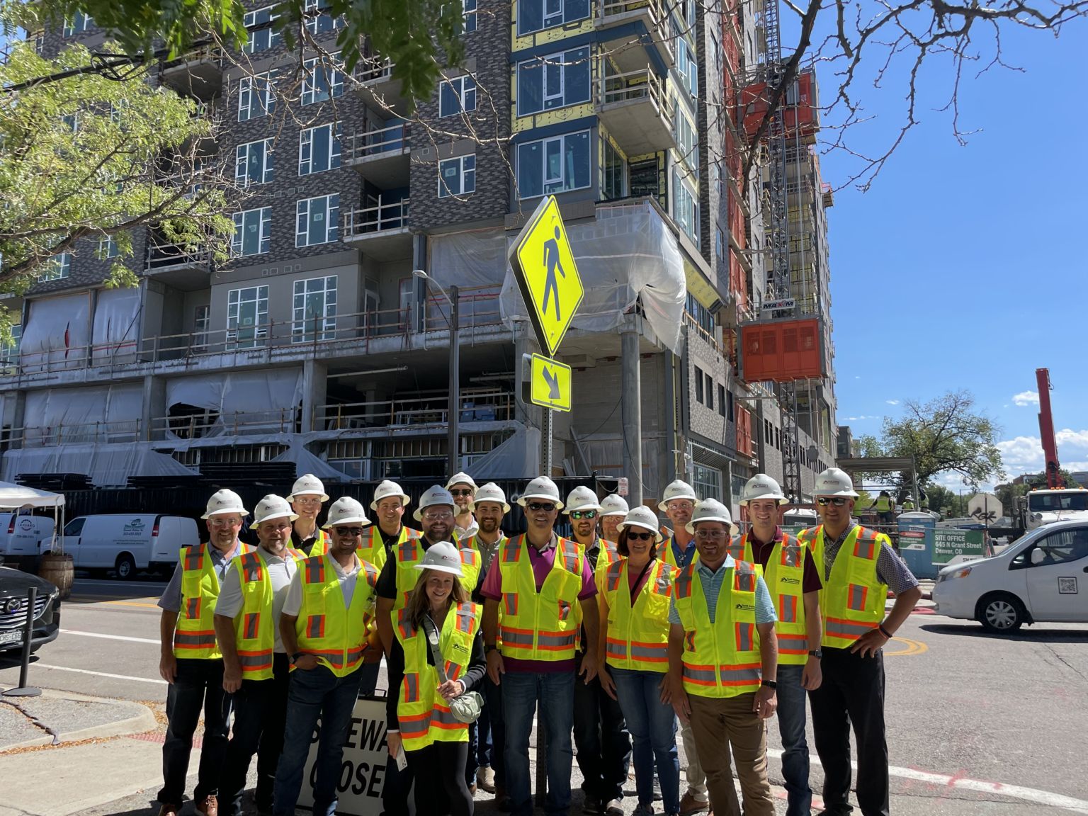 Group photo of contractors outdoors.