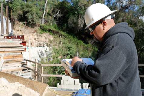 An inspector reviewing a jobsite.